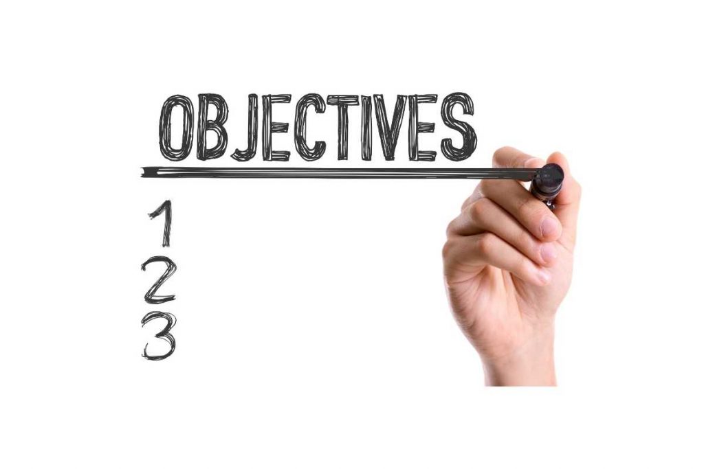 Cartel Objectives con mano escribiendo