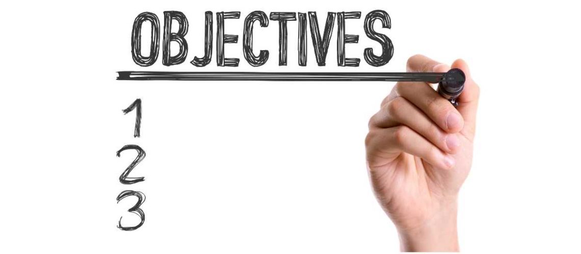 Cartel Objectives con mano escribiendo